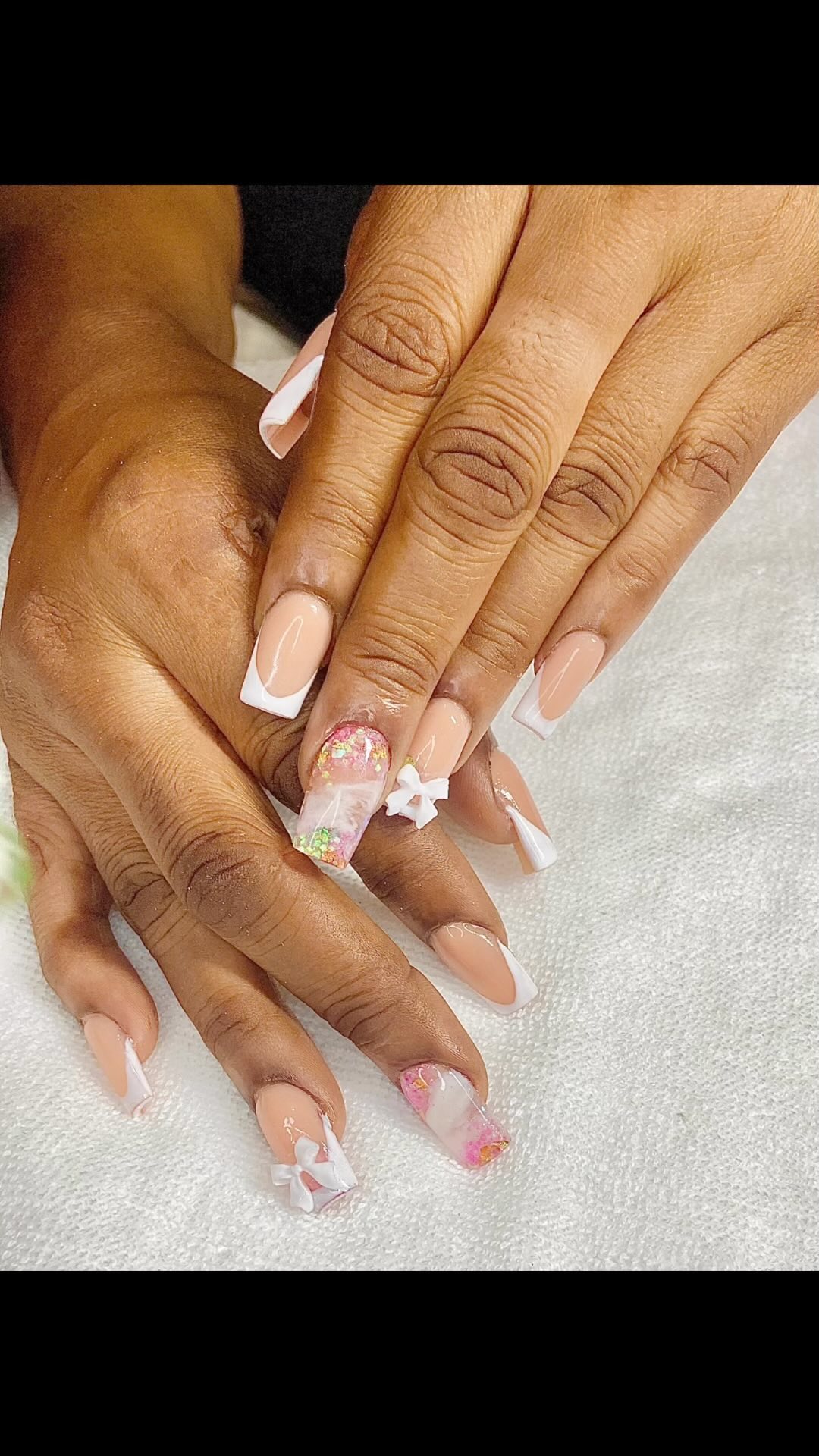 Elegant Nude and White Nails with Floral Accents