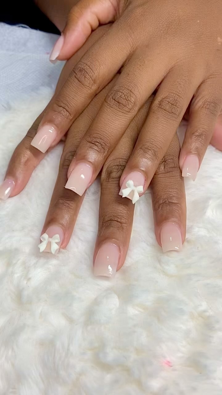 Elegant Nude Nails with Bows