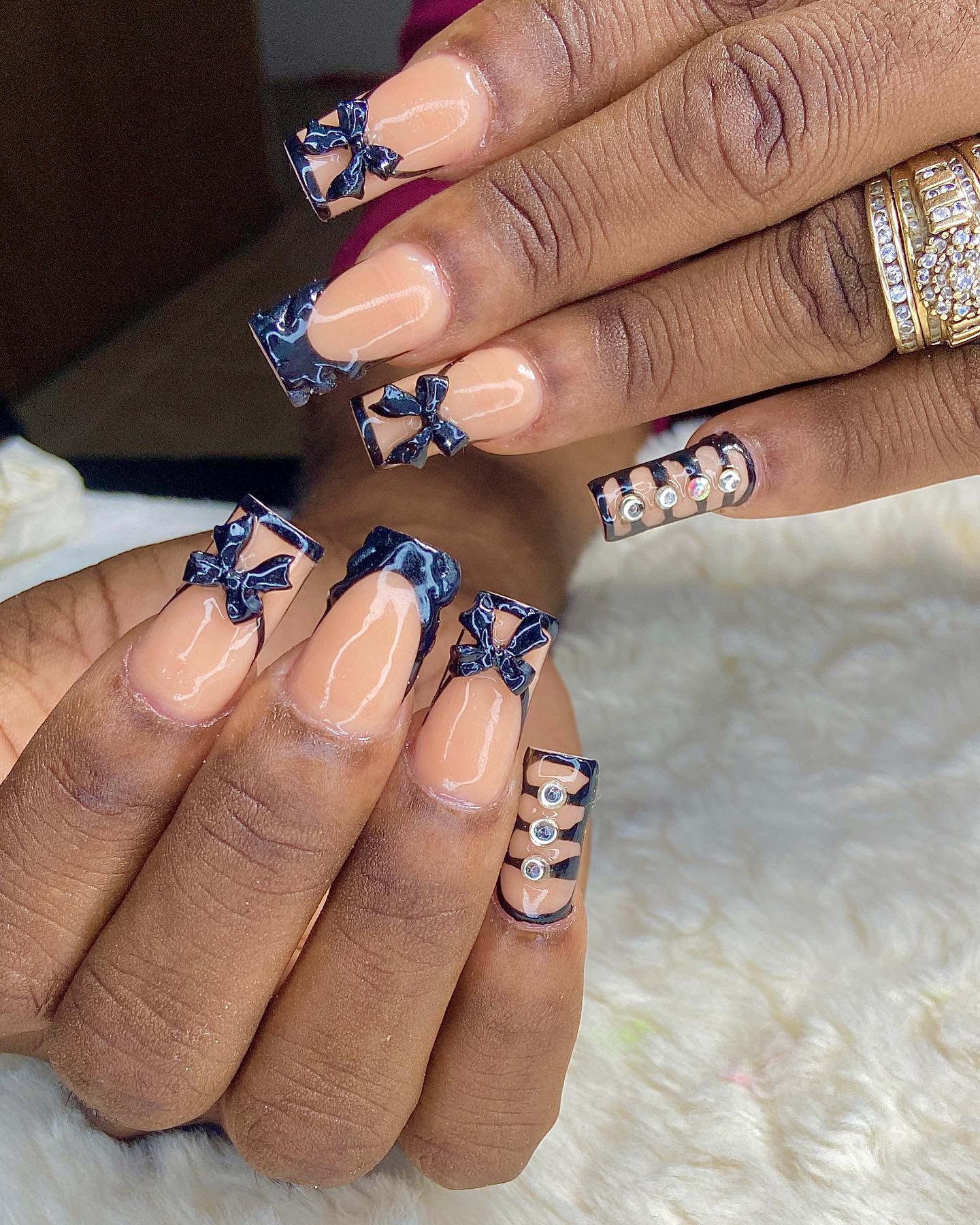 Elegant Nude and Black Nail Design