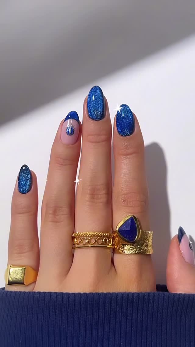 Elegant Blue Glitter Nails with Rings