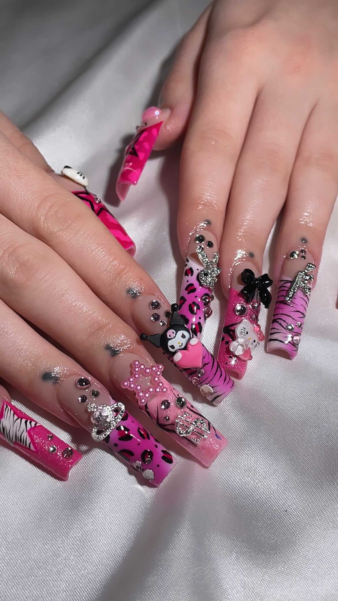 Vibrant Pink Artistic Nails with Decorations