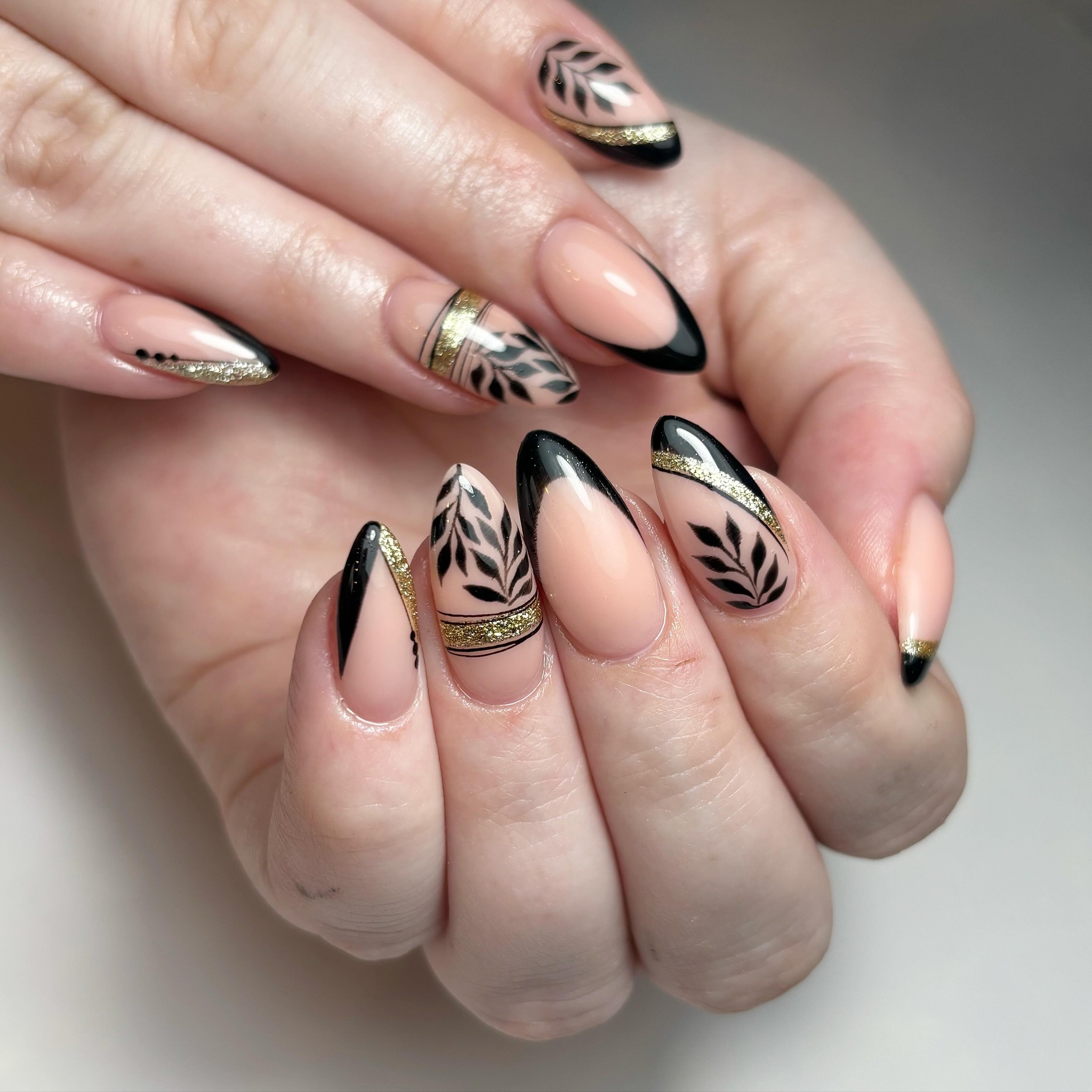 Elegant Black and Gold Floral Nail Art