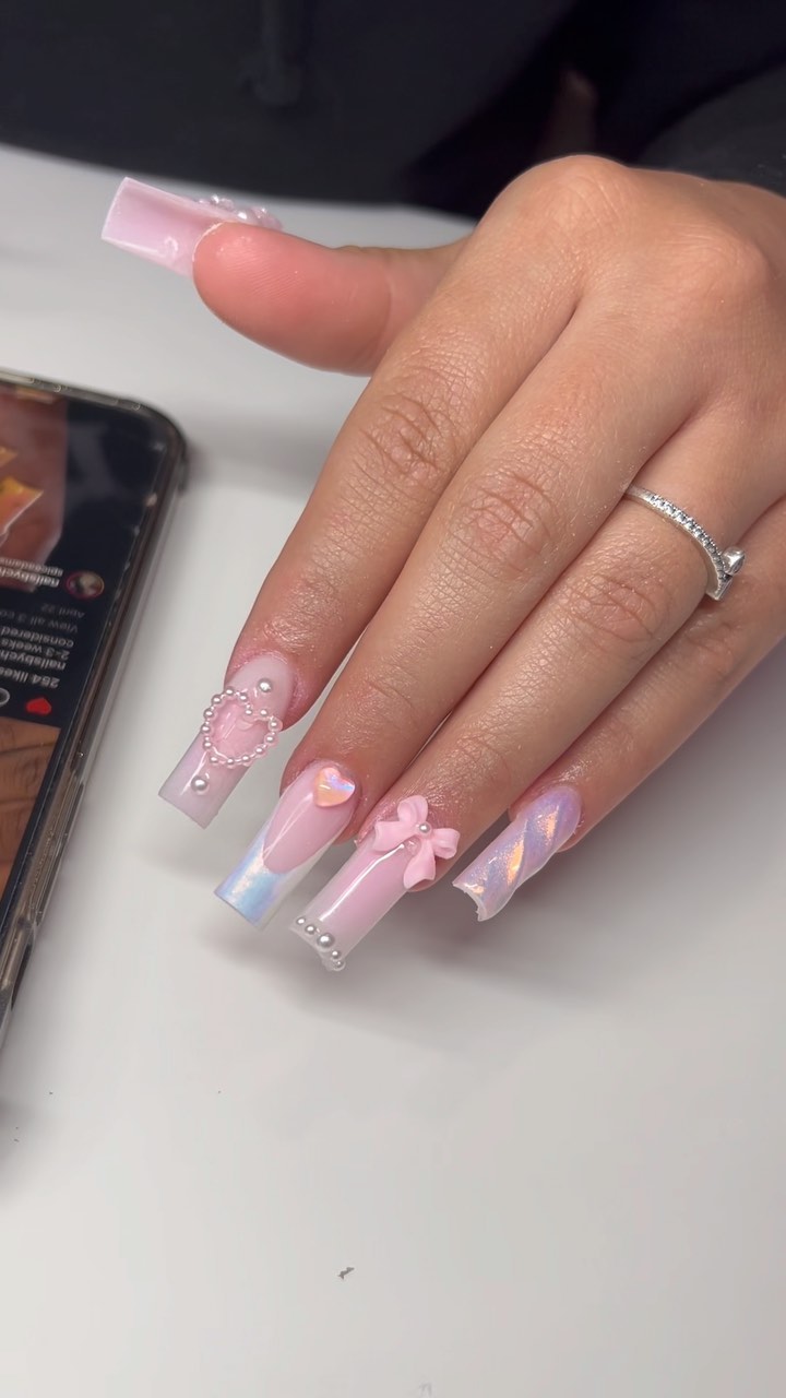 Stylish Pink Nail Design with 3D Accents